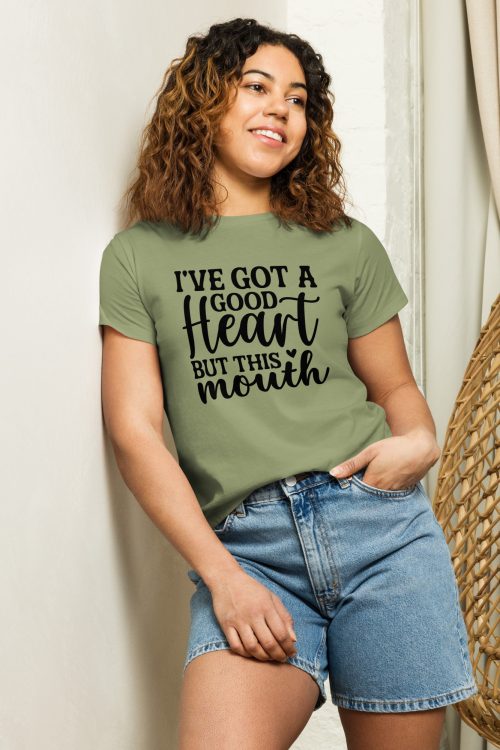 A hispanic woman wearing a artichoke shirt that reads I got a good heart but my mouth